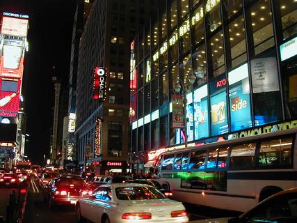 Times Square at night<br>Location: <a href="https://www.google.com/maps/search/?api=1&query=40.7579,-73.9857" target="_new">Times Square</a>